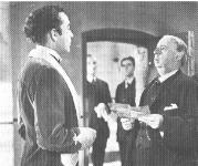 Louis Mazzini (Dennis
                  Price) meets the hangman (Miles Malleson).